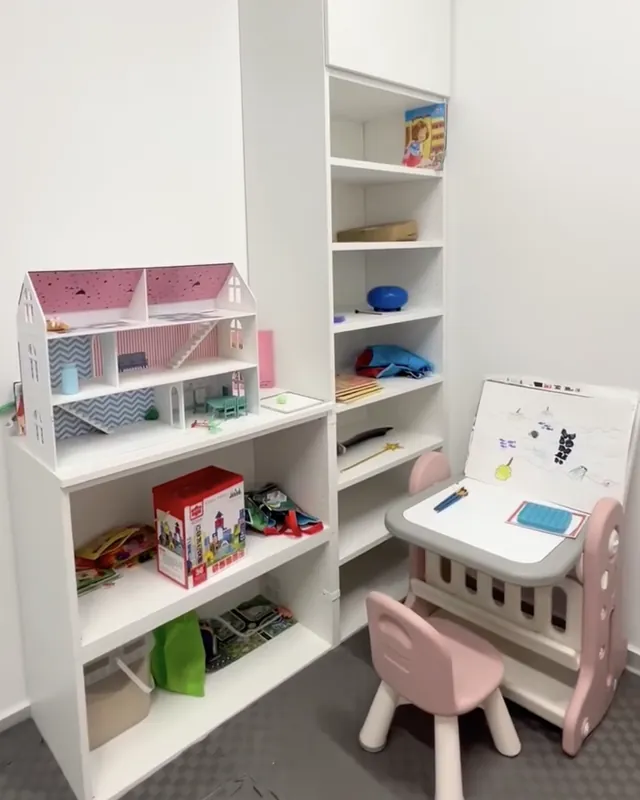 The children’s therapy room with toys and a small desk