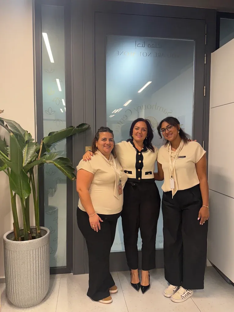 Mais Samhoury with two members of the MSC team at the center’s entrance
